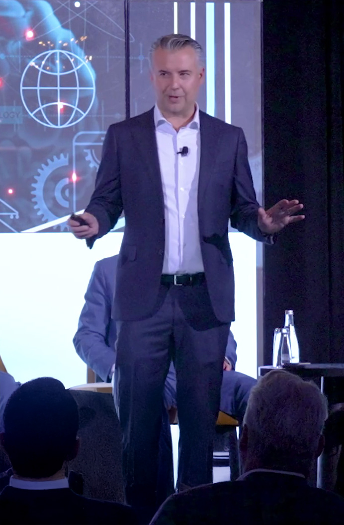 Justin Nikolaus speaking at an event